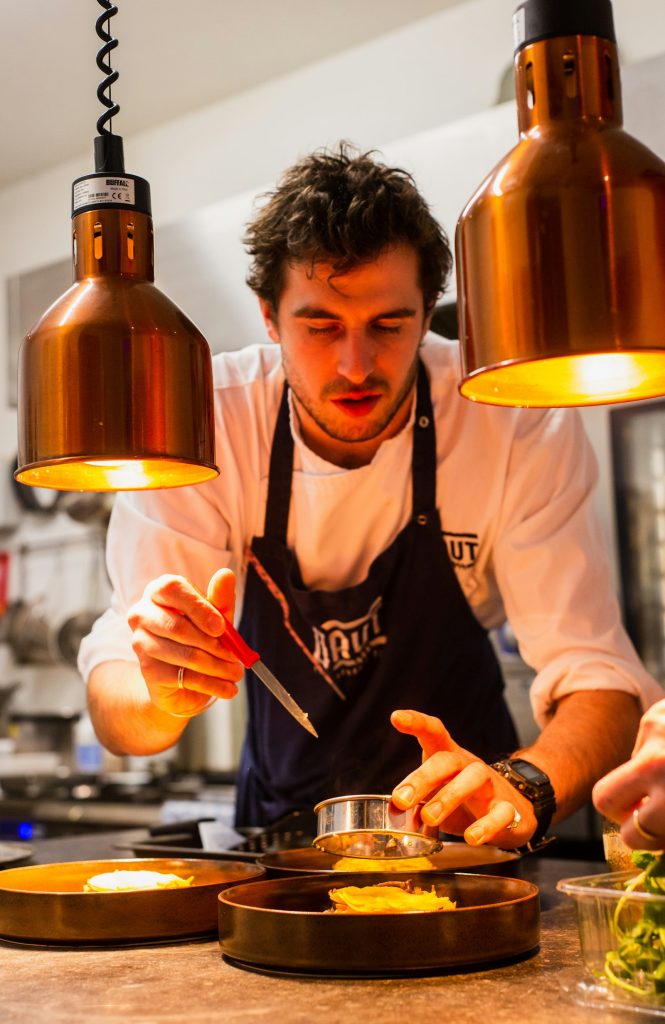 Chef carefully plating a dish