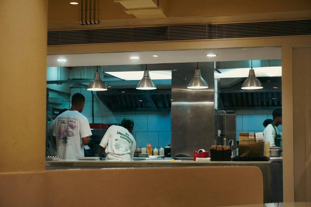 Cooks preparing meals in a commercial kitchen