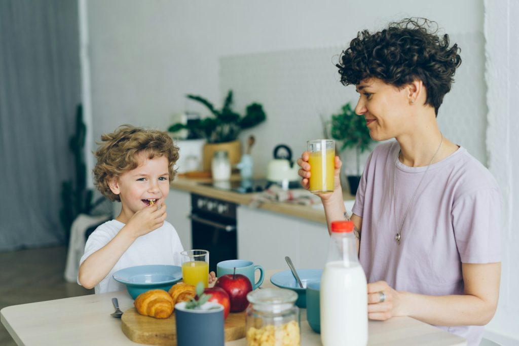 Parent and child in the kitchen in the morning